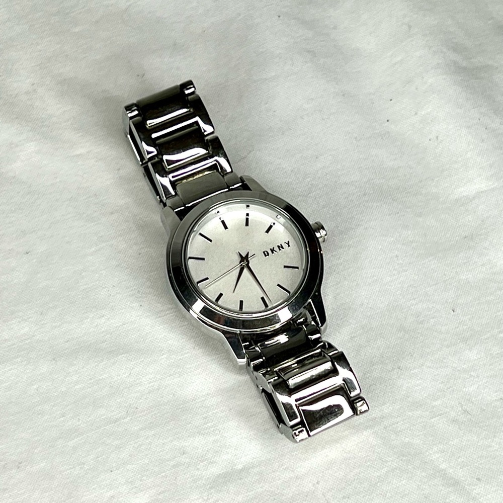 Women’s DKNY stainless steel watch.